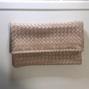 Light pink woven fold over clutch